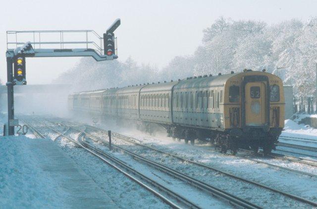 12/12/81:- 8-VEP lead by 7759 crosses the junction with the Addlestone branch at Weybridge station